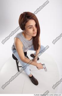 17 2020 MOLLY SITTING POSE WITH GUN 2